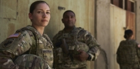 Soldiers standing outside.