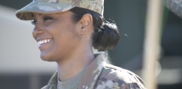 Female Soldier wearing U.S. Army uniform and demonstrating proper grooming requirements.
